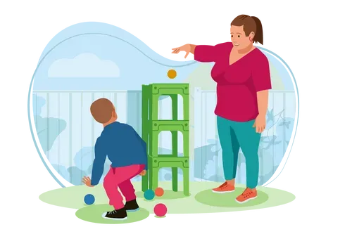 Woman and boy outside playing in garden.