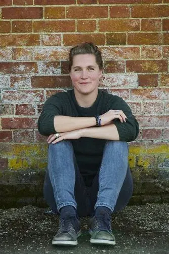 Sophie Christophy sat against a wall