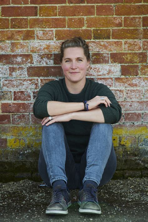 Sophie Christophy sat against a wall