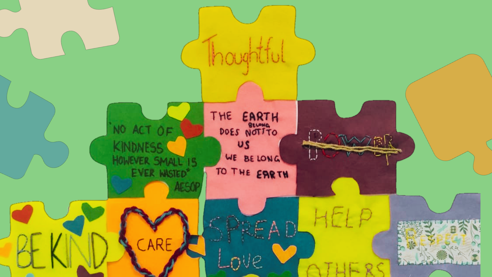Colourful textile puzzle peices with embroidered messages of hope.