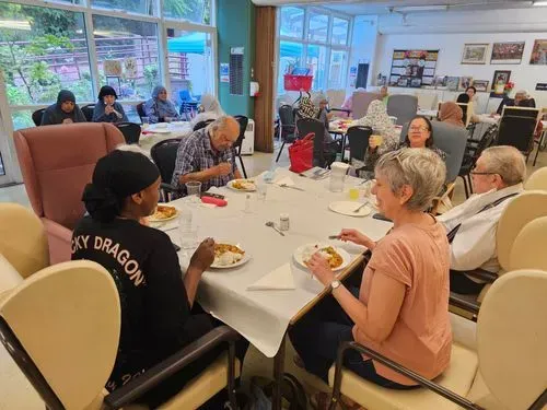 Older adults having fun and lunching