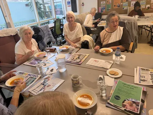Older adults enjoying lunch and socialising