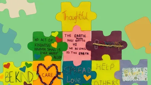 Colourful textile puzzle peices with embroidered messages of hope.