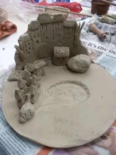 An image of houses made of clay