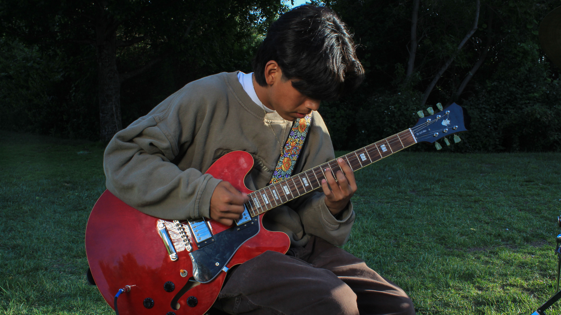 boy playing the guitar