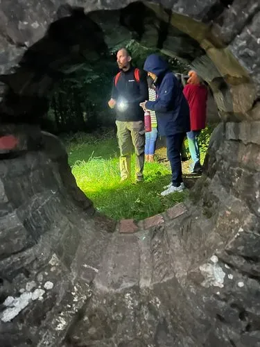 people through a hole in the wall