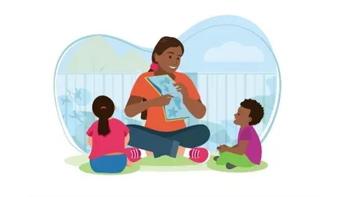 Woman sat on mat reading to boy and girl.