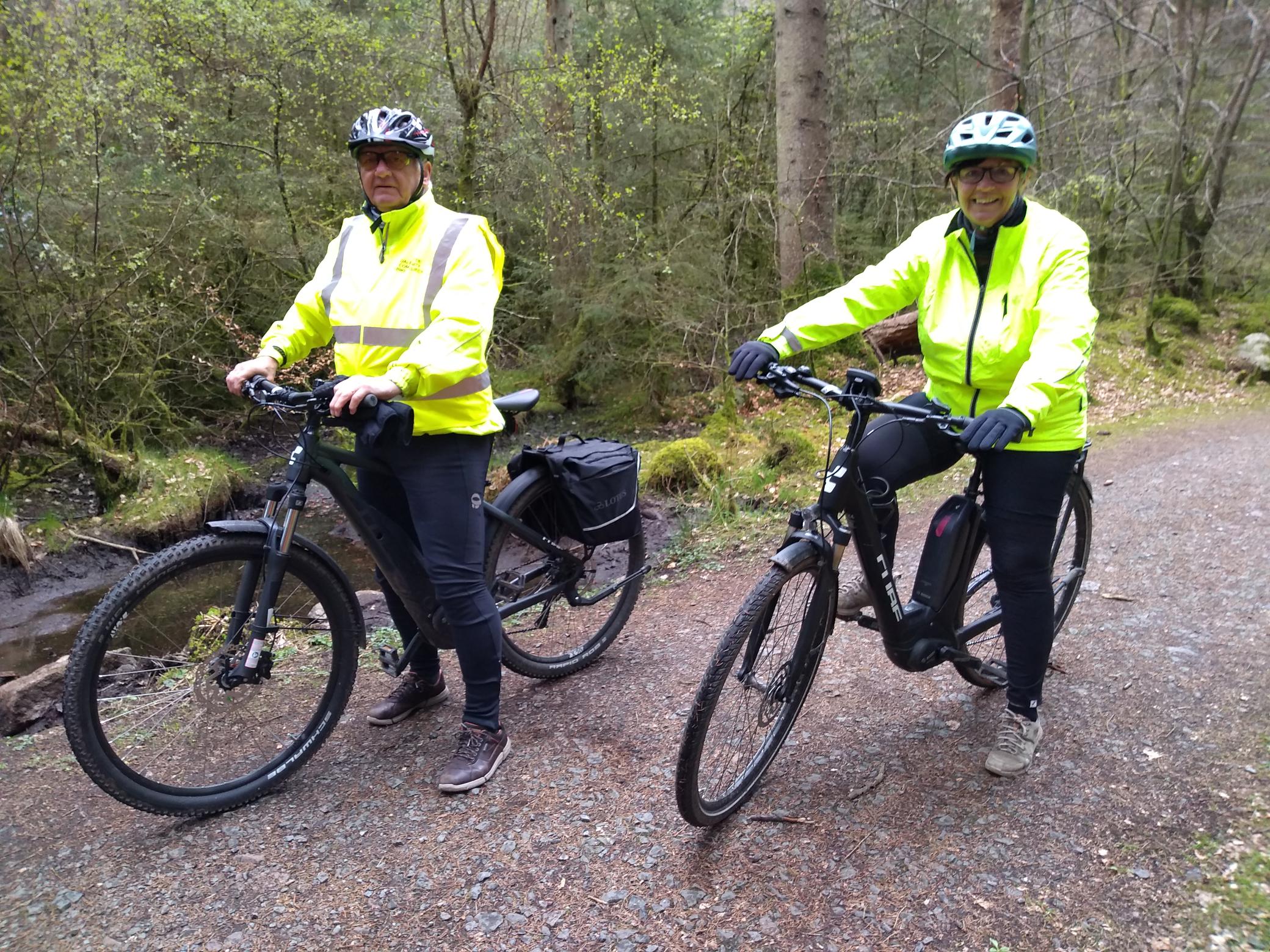 Two people trying out ebikes