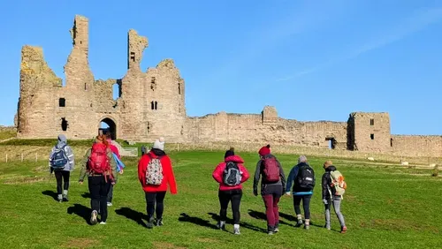 People Walking to Dunstanburgh Castle