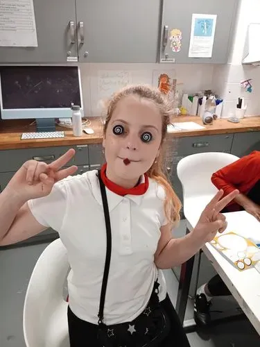 A young person modelling an eye mask they made in The Canvas, our art room at WEST!