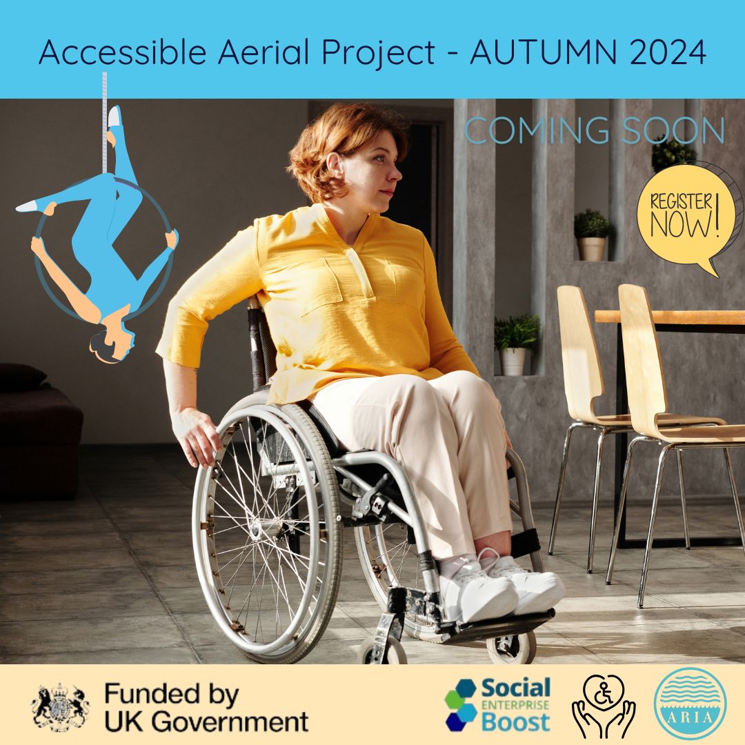 image of a woman in a wheelchair outside a cafe, in the background a woman on aerial silks