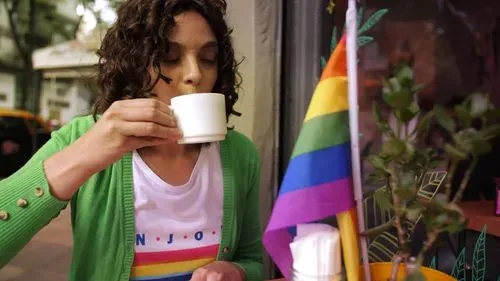 LGBTQ female drinking coffee