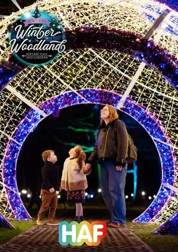 Family stood inside the giant bauble