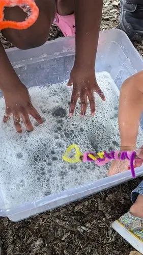 a bucket with soapy water
