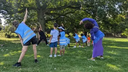 children doing exercises on the grass