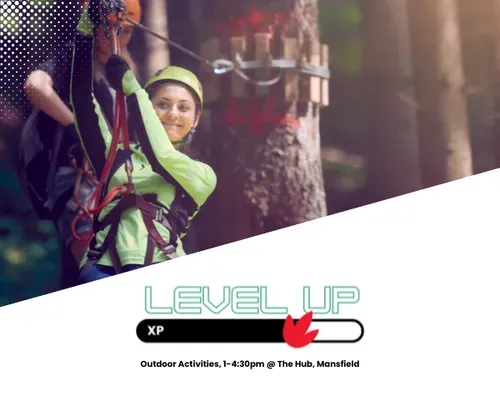 Young woman on tree top obstacle course