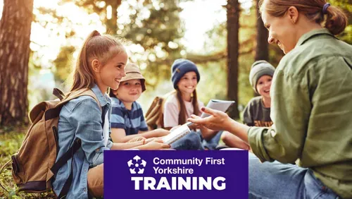 Adult female chatting to children in a woodland setting with the word training under the Community First Yorkshire logo on a purple content block