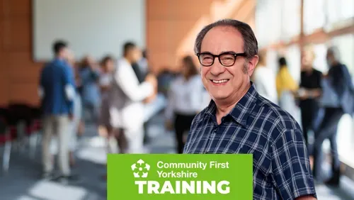 Older gentleman against a backdrop of a meeting with the Community First Yorkshire logo and the word training on a green content block