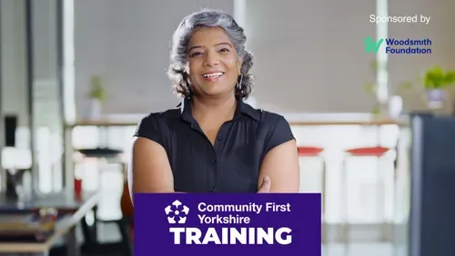 Woman with arms folded smiling to camera with the Community First Yorkshire logo and the word Training against a purple colour block