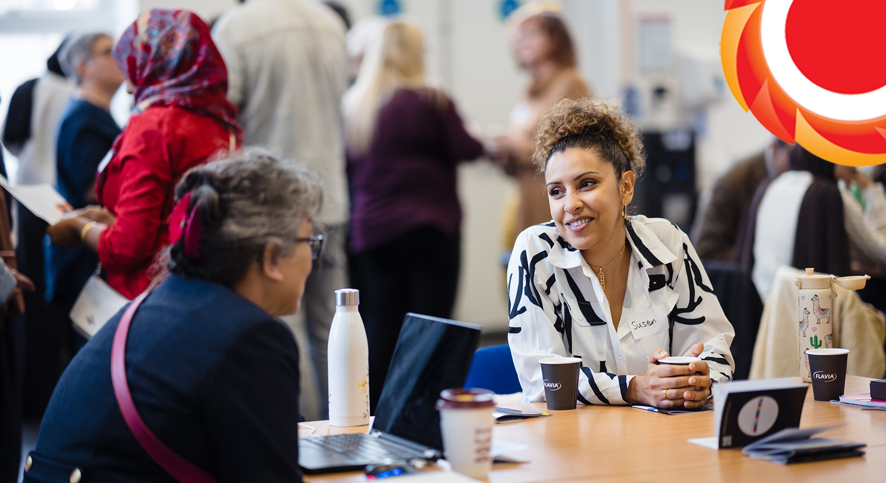 Photograph of 2 of the participants of the Cornerstone Tower Hamlets Learning event. THCVS logo in the top right hand corner.