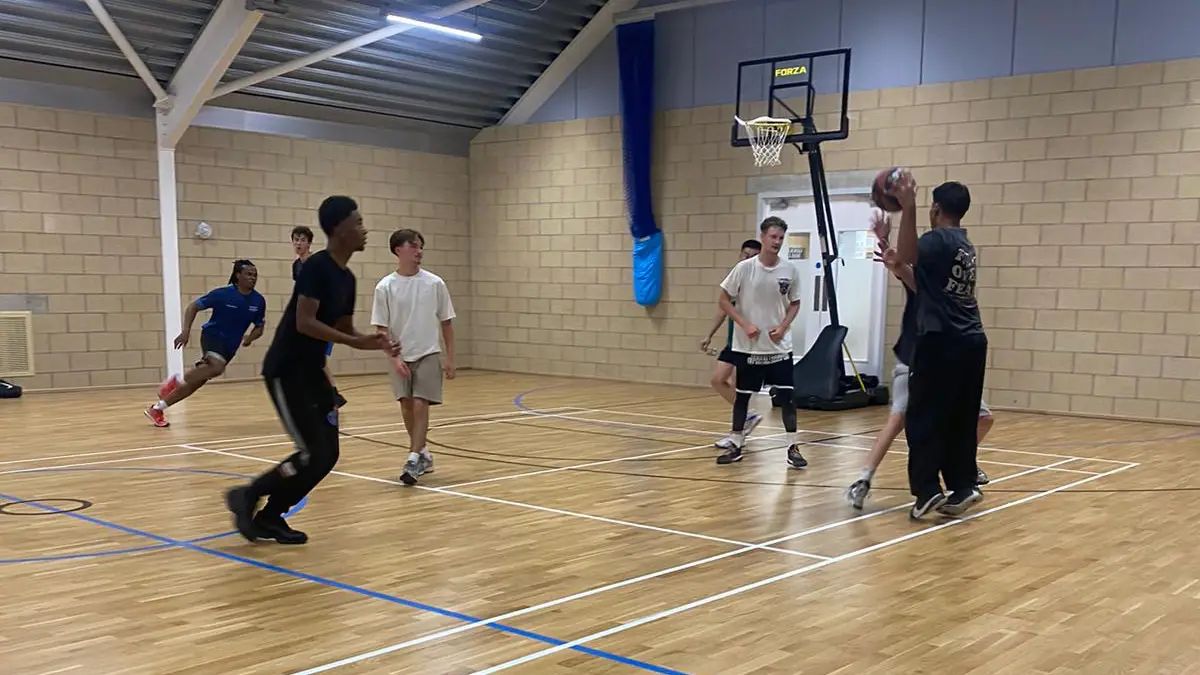 Young people playing basketball