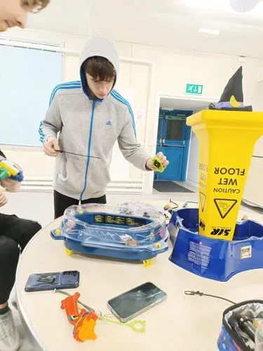 Young person playing Beyblades