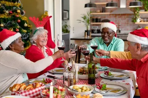 Older people enjoying a Christmas lunch