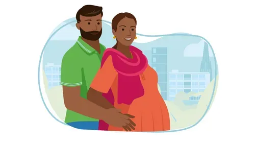 Man and pregnant woman standing together.  Man's arms around pregnant woman.