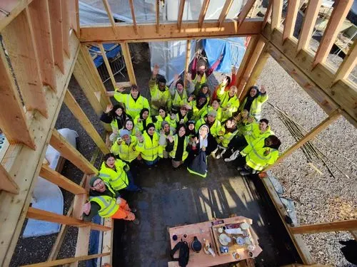 Multiple people standing in the frame of our kitchen building