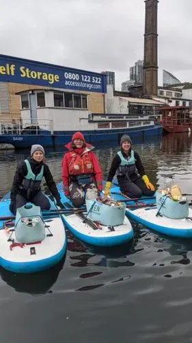 3 litterpickers on regent's canal in winter clothing
